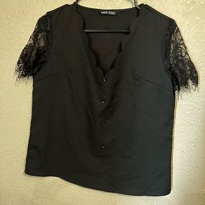 Black lace sleeved top with scalloped neck line